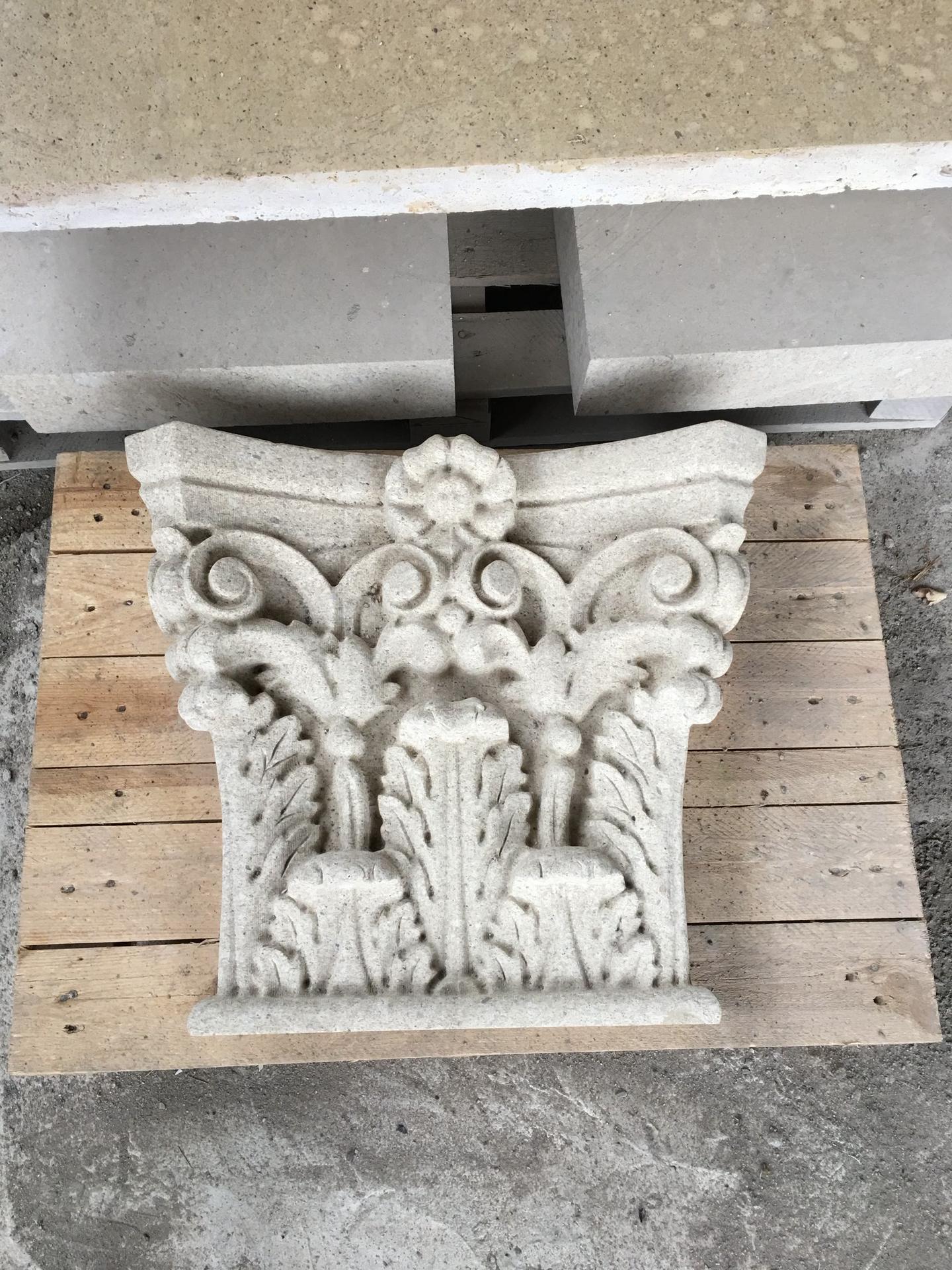 Carved Corinthian capital in travertine