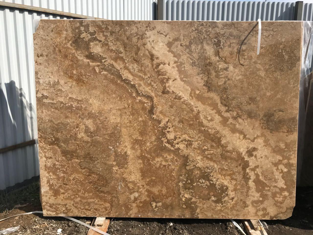 Cross-cut travertine slab showing its cloudy pattern