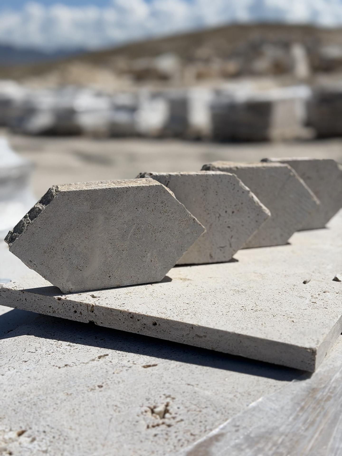 Travertine paving pieces cut to an elongated hexagon