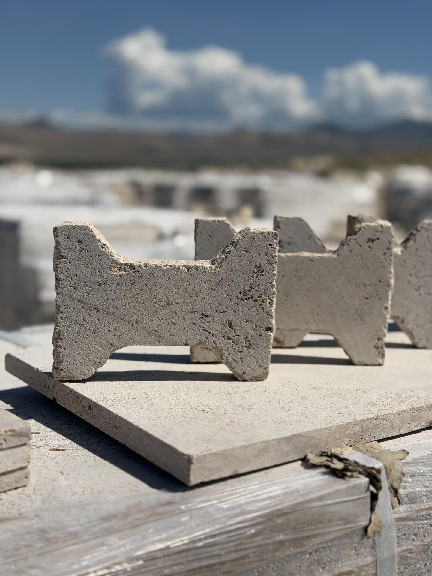 I-shaped travertine pavers standing on a slab
